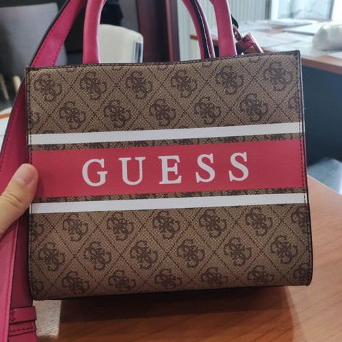 Guess handbag like new, fuchsia color with extra strap