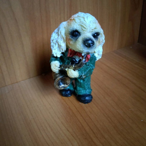 Decorative dog figure with saxophone like new