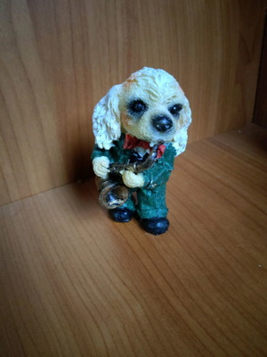 Decorative dog figure with saxophone like new