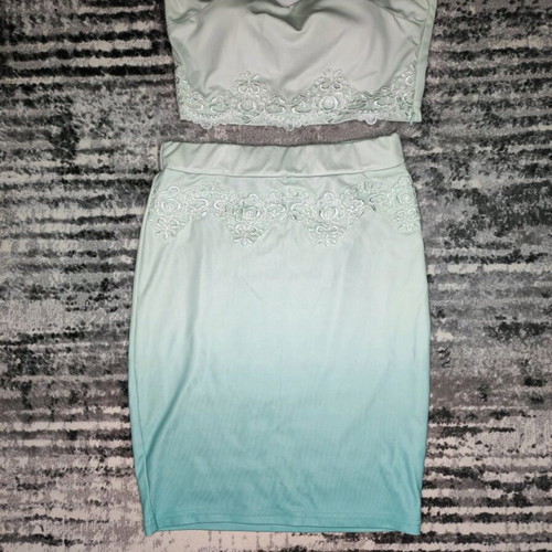 Women's clothing set used, turquoise with lace details