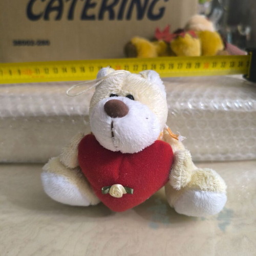 Small teddy bear with heart like new