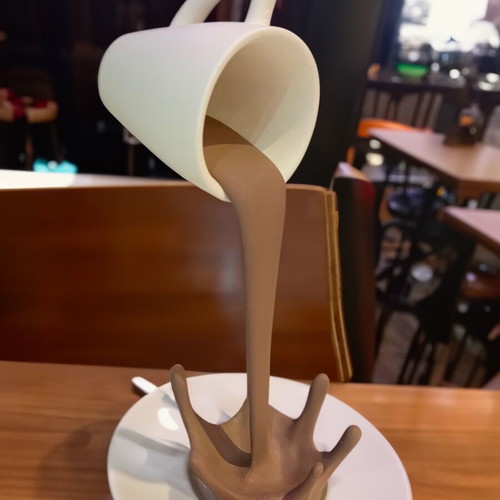 Decorative coffee cup that spills new