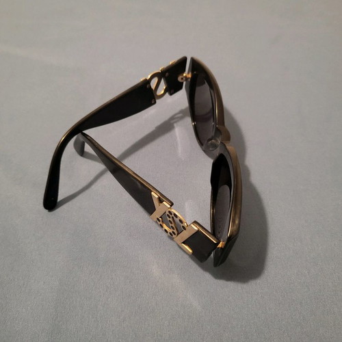 Yves Saint Laurent sunglasses used, black with gold logo