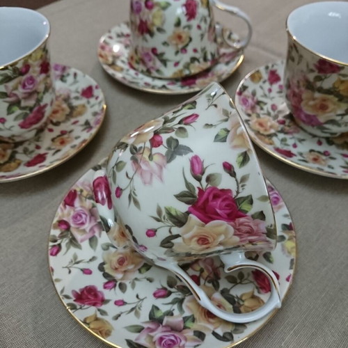 Tea and Coffee Cup Set like new, porcelain with floral pattern