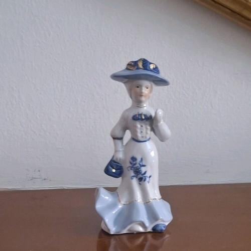Retro porcelain woman figurine with gold details like new