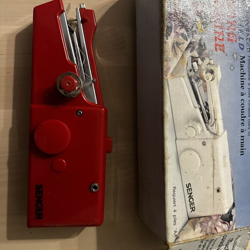 Handheld sewing machine used, cordless