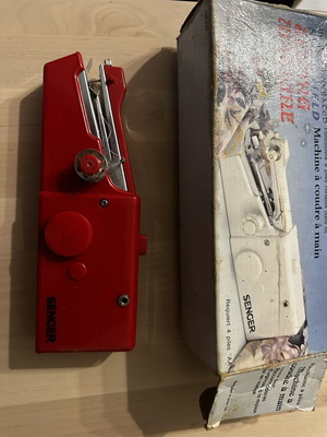 Handheld sewing machine used, cordless