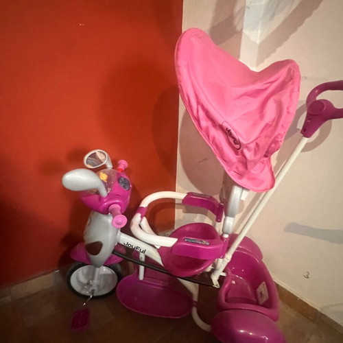 Tricycle like new with canopy, footrest and safety bar