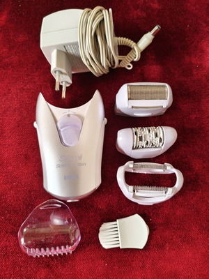Braun Silk-épil SoftPerfection epilator used with accessories