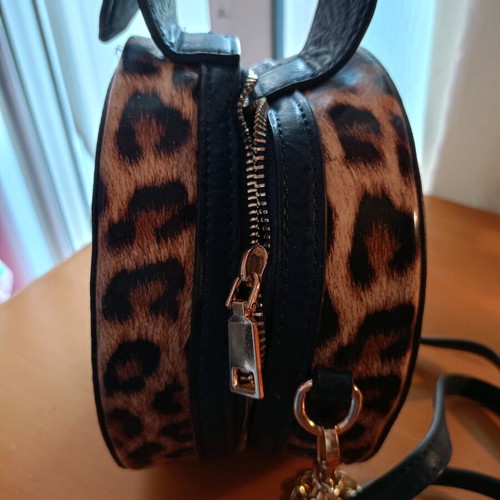 Crossbody bag like new dark blue round with animal print patent