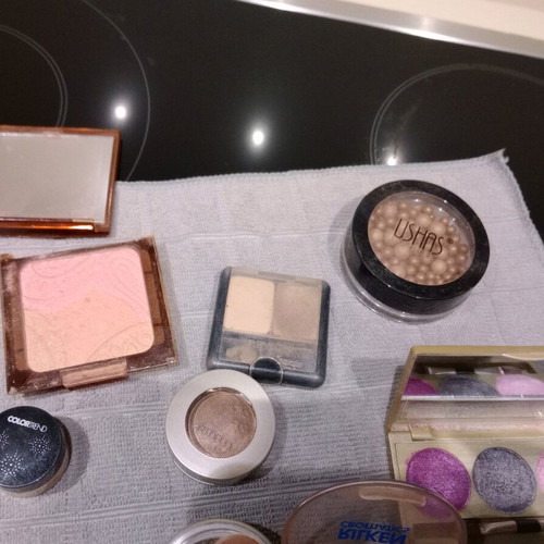Cosmetics set used with eyeshadows, blushes, lipstick, and lip gloss