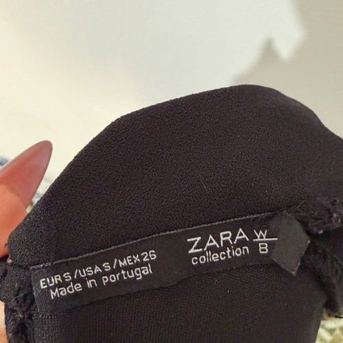 Zara one-piece shortsuit used, black with ruffles and open back