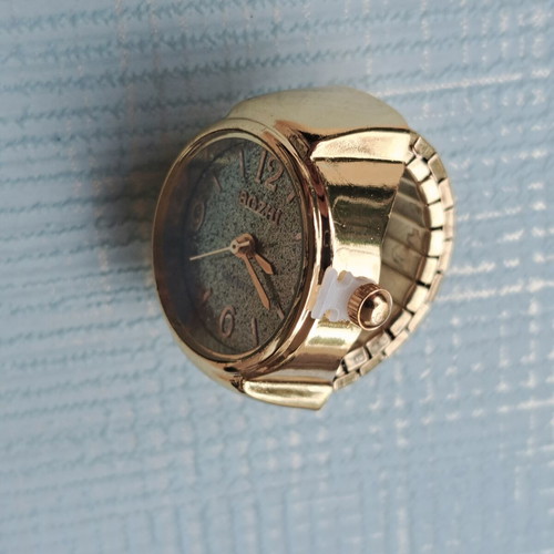 Ring watch quartz with khaki dial and gold bracelet like new