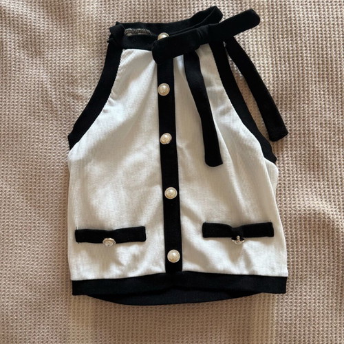 Sleeveless top like new, white with bow and pearl buttons