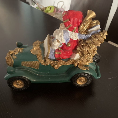 Christmas decoration Santa Claus in vintage car like new