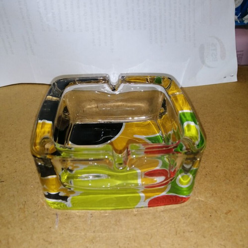 Glass ashtray with colorful bottom like new