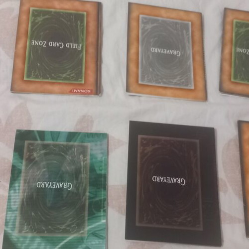 Yu-Gi-Oh! rule books and deck zones, like new, set of 14 each