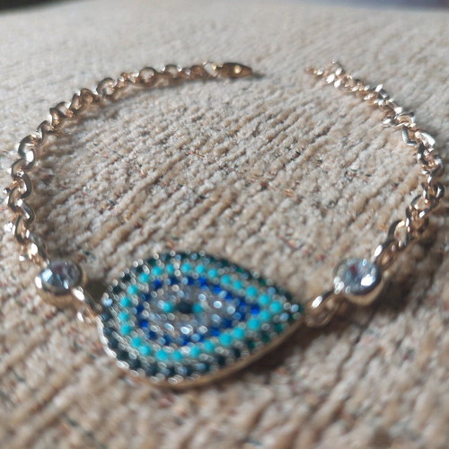 Gold bracelet new with eye and blue, turquoise, white stones