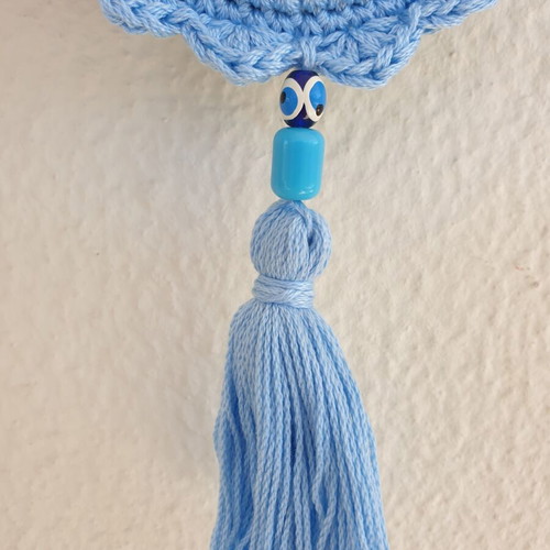 Handmade baby blue crocheted eye decoration