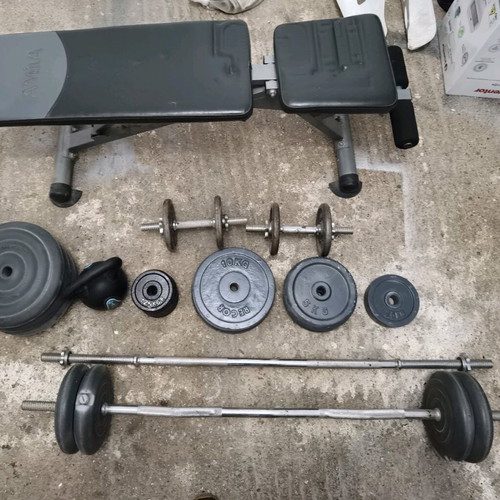Gym equipment and weights used, set with Amila bench