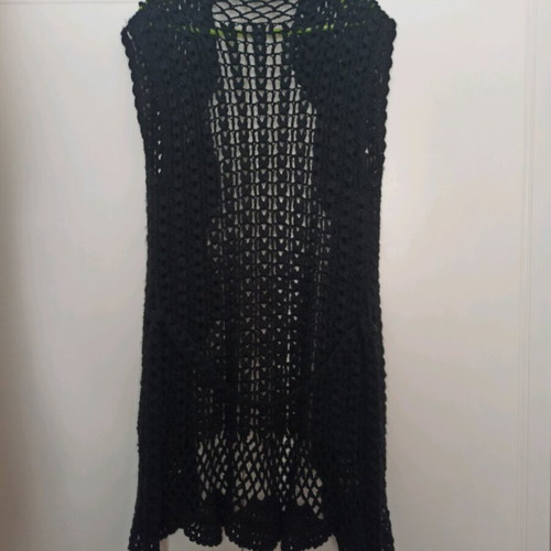 Knitted openwork kazaka in black color like new, size medium - large