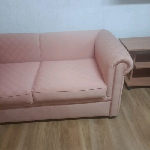 Vintage two-seater sofa used, salmon color in very good condition