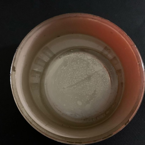 Vintage orange glass ashtray used
