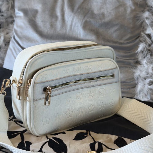 White bag with gold details and unique design, new