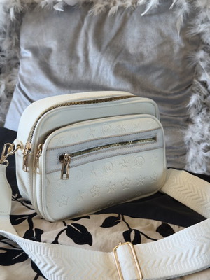 White bag with gold details and unique design, new