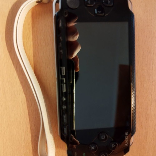 PlayStation Portable (PSP) 1004k Value Pack used with 3 games and manual