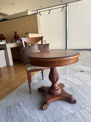 Round walnut table like new with carved leg