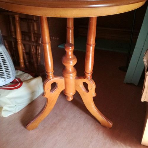 Wooden round coffee table used with carved base