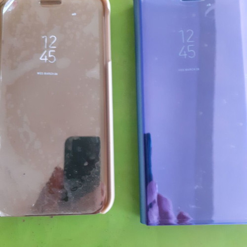 Θήκες πορτοφόλι για Samsung J7, μία καινούργια και μία ελαφρώς μεταχειρισμένη με μικρό σπάσιμο στη γωνία