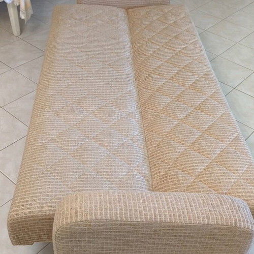 Practical three-seat sofa bed like new with storage compartments