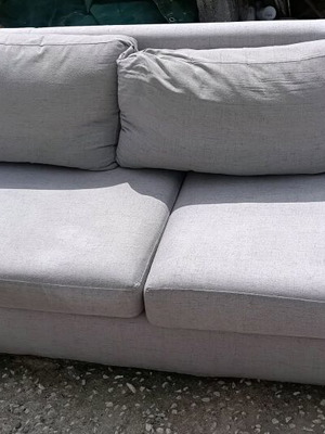 Gray three-seater heavy-duty sofa used with curved end