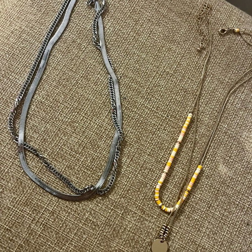 Necklaces with double chain like new, silver and gold with stones