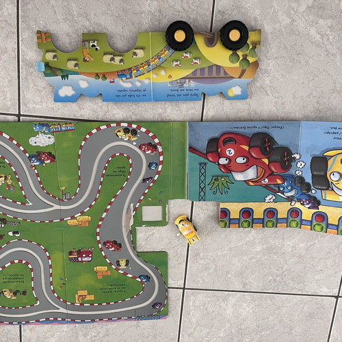 Children's books with toy and wind-up car
