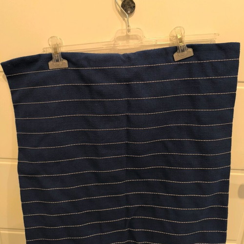 Blue navy pillowcase used with white stitching and wooden buttons