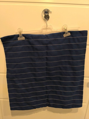 Blue navy pillowcase used with white stitching and wooden buttons