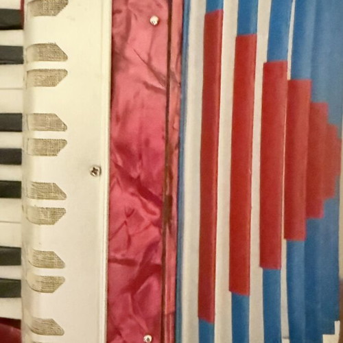 Children's accordion used, red with blue and red bellows