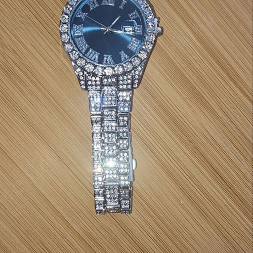 Quartz watch new with large dial and sparkling artificial diamonds