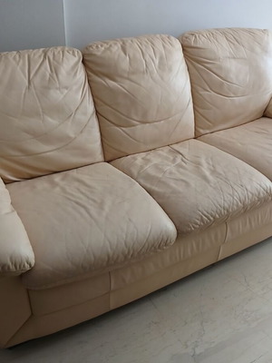 Leather sofa used, beige three-seater with sturdy construction