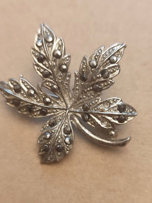 Silver-plated brooch with marcasites used, maple leaf shape