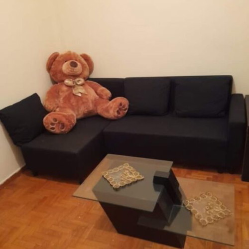 Lugnvik IKEA corner sofa bed used with storage and coffee table
