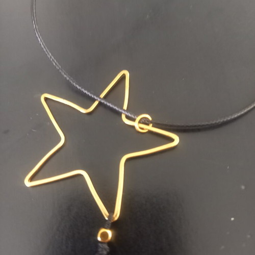 Pendant like new with subtle black and gold details