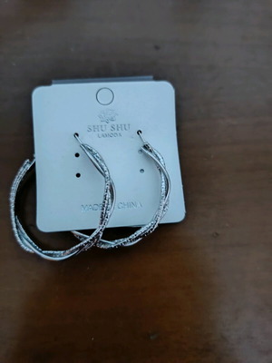 Steel earrings unused, silver color