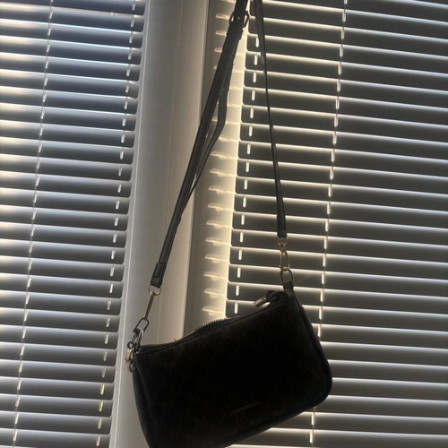Brown crossbody bag like new with charm flower