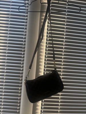 Brown crossbody bag like new with charm flower