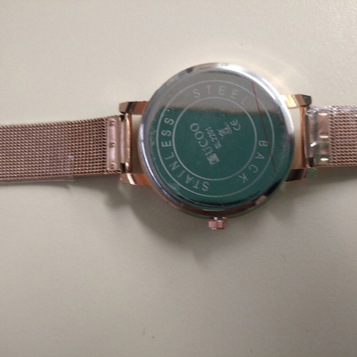 Women's watch new with embossed gold butterfly, pink-gold color