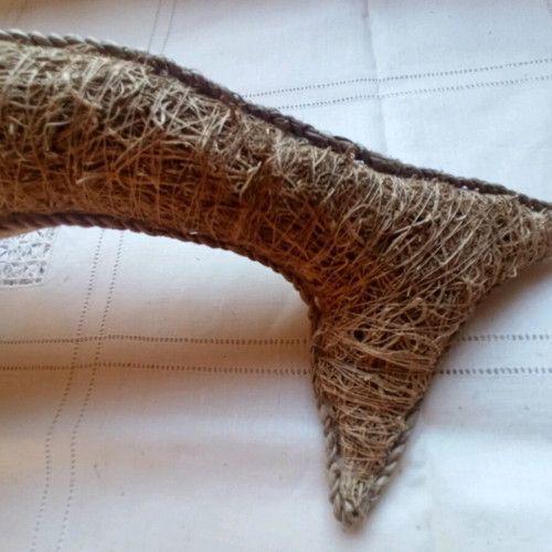 Handmade decorative dolphin made of grass